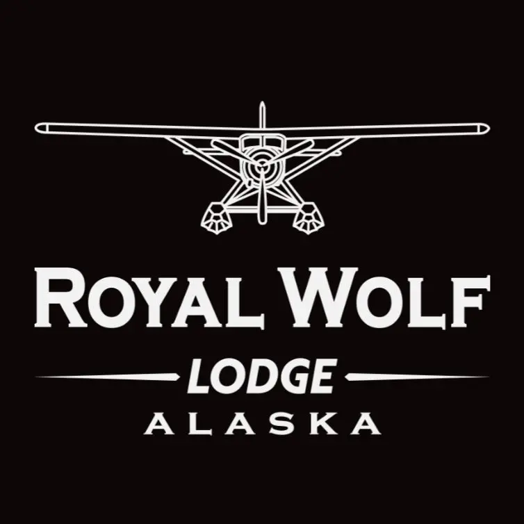 Logo of Royal Wolf Lodge in Alaska featuring a seaplane illustration.
