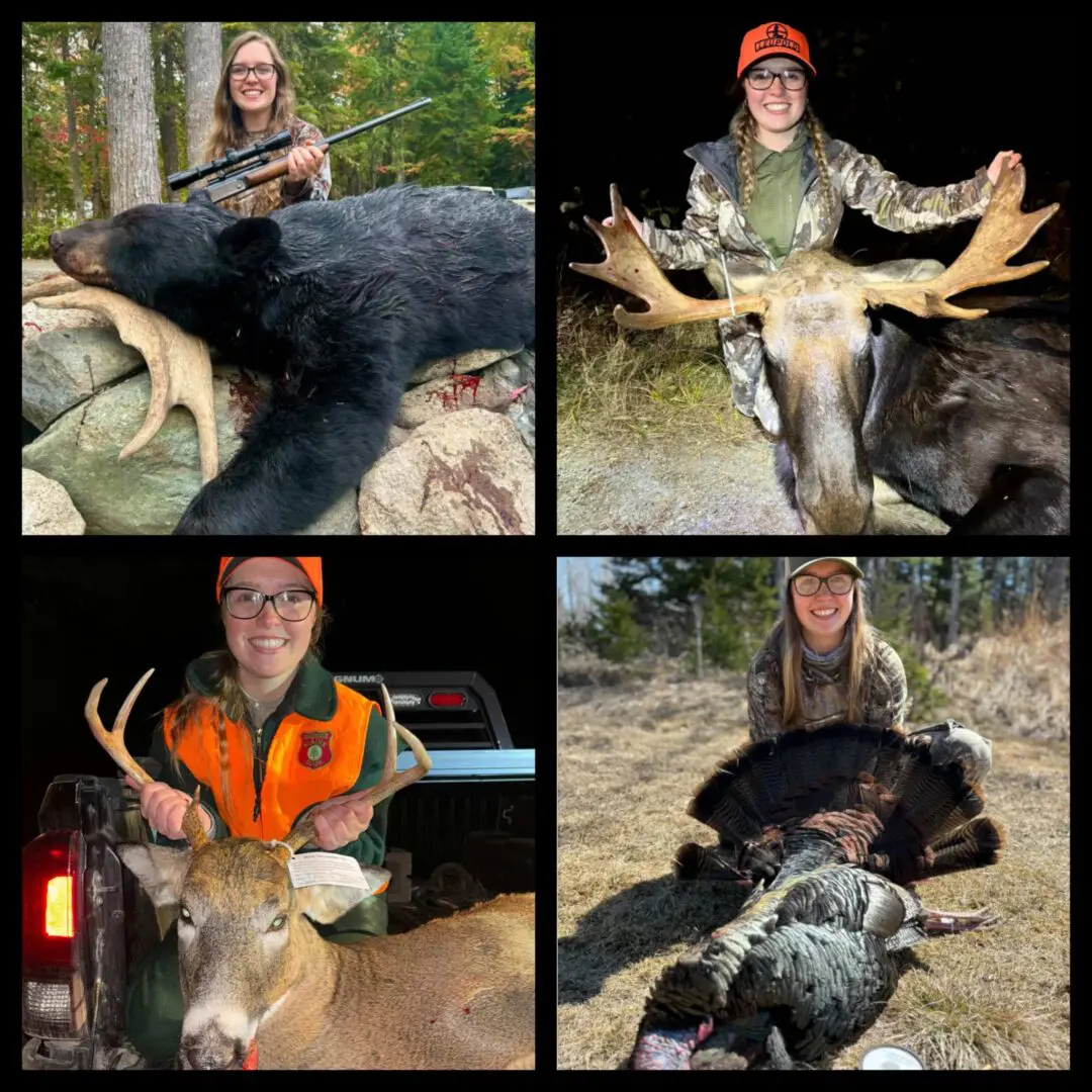 Four hunters posing with their large game trophies including a bear, moose, deer, and turkey.