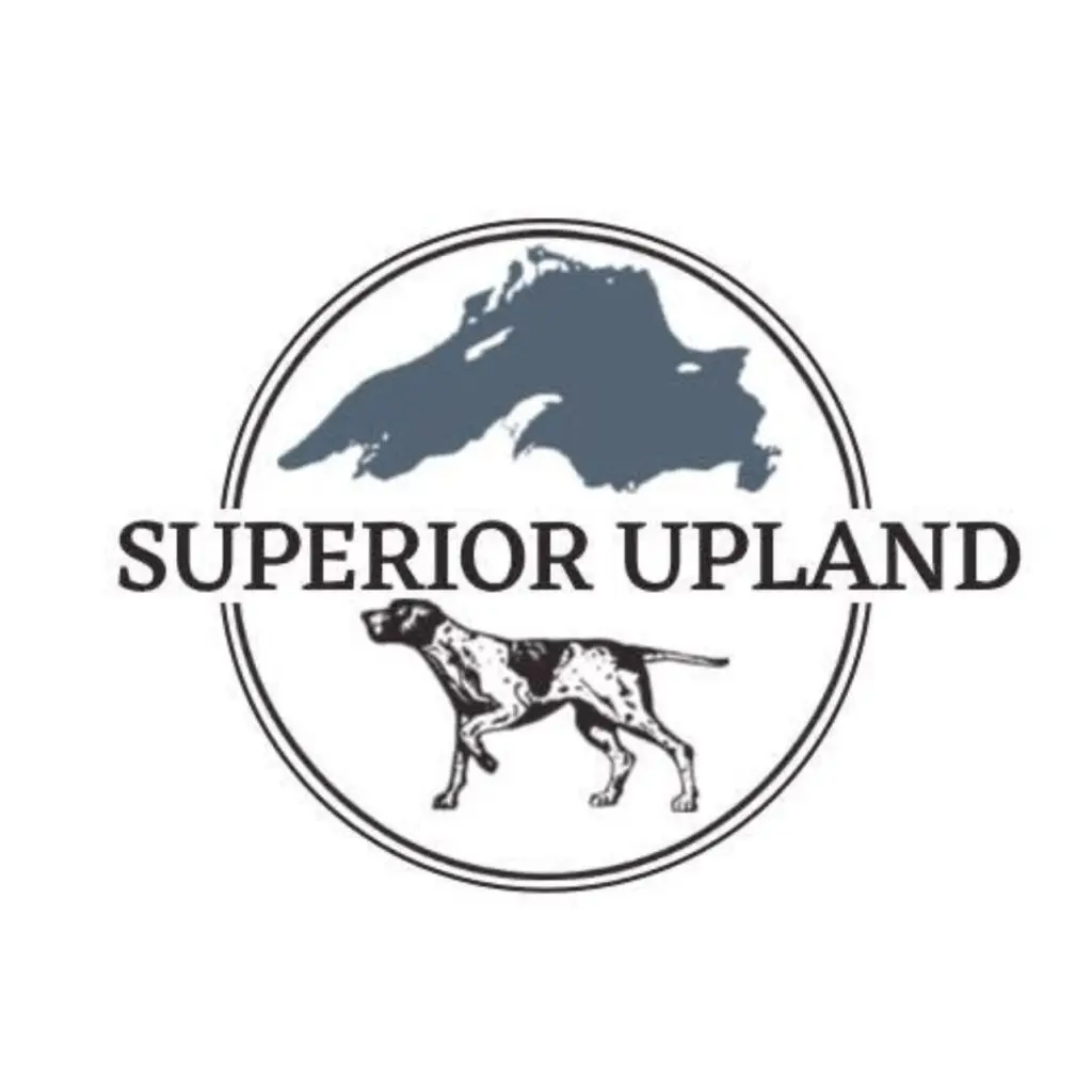 Logo of Superior Upland featuring a dog and a bird within a circular frame.